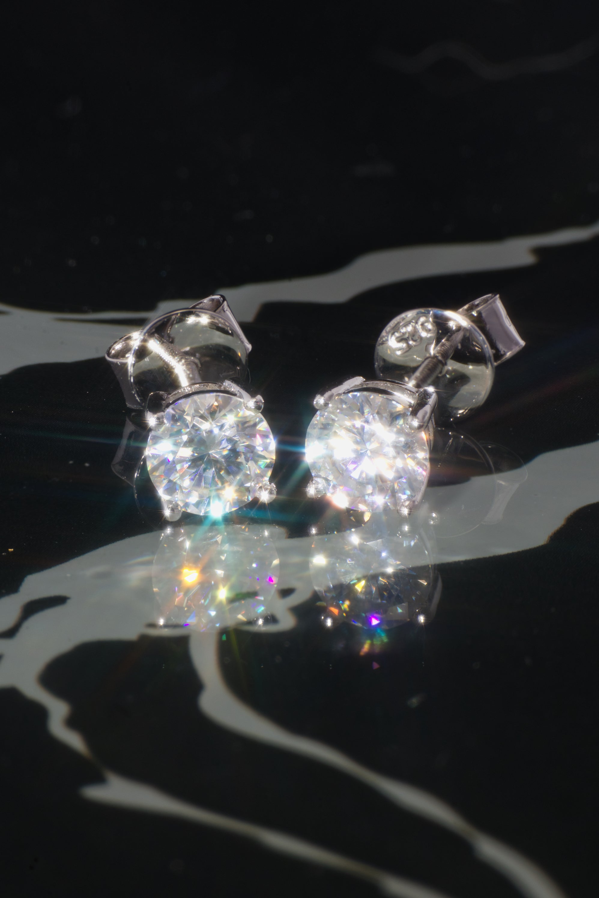 The "PURE" White Gold Solitaire Diamond Stud Earrings